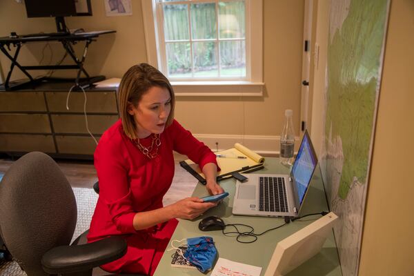 Lyndsey Rudder, Republican candidate for state House District 54,  speaks with her campaign finance director Amy Doehrman in her makeshift basement office at her residence in Atlanta on Sept. 14, 2020.  (Alyssa Pointer / Alyssa.Pointer@ajc.com)