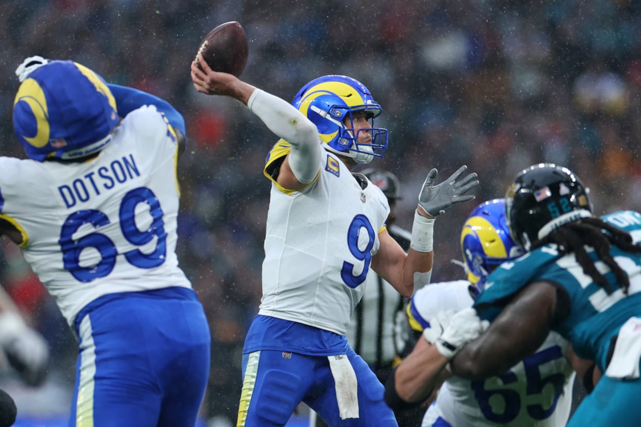 Los Angeles Rams quarterback Matthew Stafford (center) passes the ball during the first half against the Jacksonville Jaguars on Sunday, Oct. 19, 2025, in London. Stafford was 21-of-33 passing for 182 yards, despite less-than-ideal conditions. (Ian Walton/AP)
