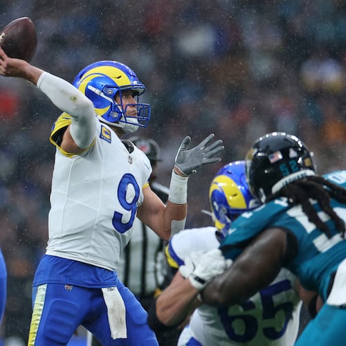 Los Angeles Rams quarterback Matthew Stafford (center) passes the ball during the first half against the Jacksonville Jaguars on Sunday, Oct. 19, 2025, in London. Stafford was 21-of-33 passing for 182 yards, despite less-than-ideal conditions. (Ian Walton/AP)