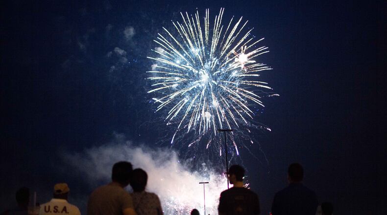 Fireworks illuminate the skies over Lenox Square during the annual July 4th event, Saturday, July 4, 2015, in Atlanta. Lenox Square held Atlanta's 56th Independence Day celebration and is the Southeast's largest firework show. BRANDEN CAMP/SPECIAL