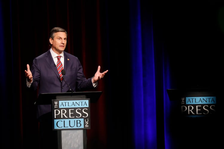 Former football coach Derek Dooley, a Republican candidate for the U.S. Senate, responds to a question at the Atlanta Press Club Loudermilk-Young debate at Georgia Public Broadcasting in Midtown on Sunday, April 26, 2026. (Miguel Martinez/AJC)