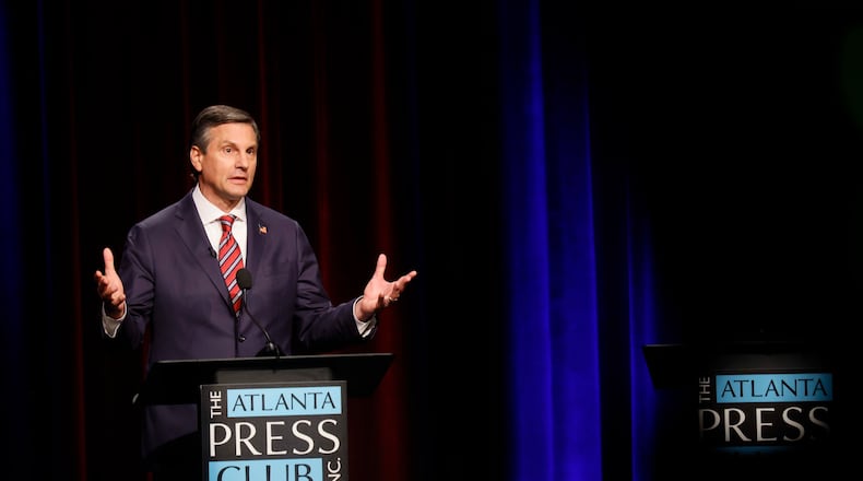 Former football coach Derek Dooley, a Republican candidate for the U.S. Senate, responds to a question at the Atlanta Press Club Loudermilk-Young debate at Georgia Public Broadcasting in Midtown on Sunday, April 26, 2026. (Miguel Martinez/AJC)