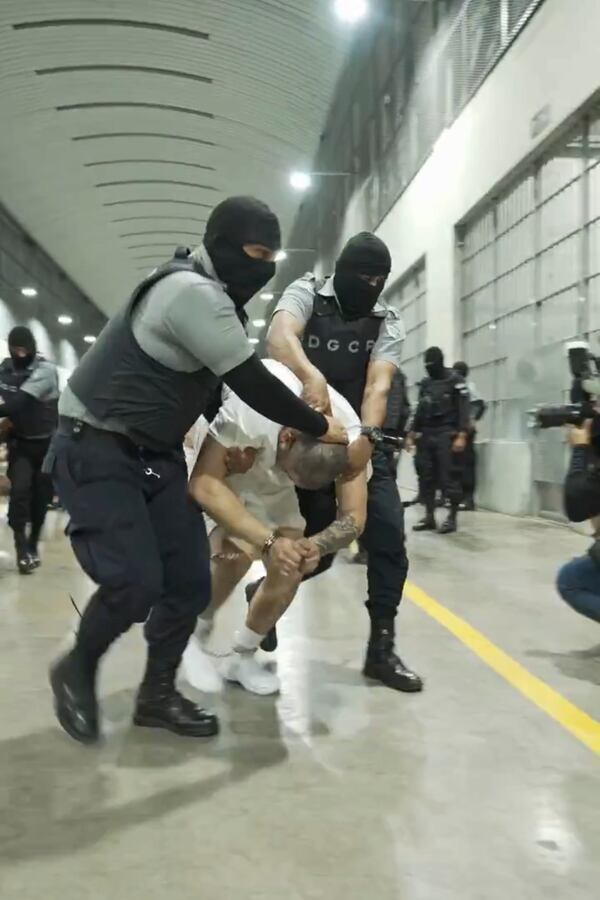 In this undated photo provided by the U.S. District Court for the District of Maryland, a man identified by Jennifer Vasquez Sura as her husband, Kilmar Abrego Garcia, is led by force by guards through the Terrorism Confinement Center in Tecoluca, El Salvador. (U.S. District Court for the District of Maryland via AP)