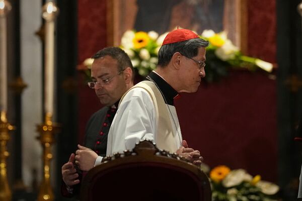 Cardinal Luis Antonio Gokim Tagle, right, leaves after a rosary prayer outside the Santa Maria Maggiore Basilica, where the late Pope Francis will be buried, in Rome, Thursday, April 24, 2025. (AP Photo/Andreea Alexandru)