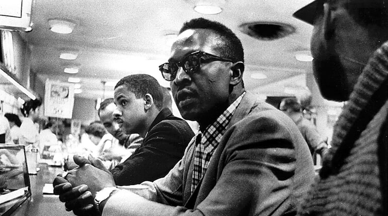 Black youths sit at the counter at the F.W. Woolworth store in Greensboro, N.C., in February 1960. They waited in vain for food service. AP NEWSFEATURES