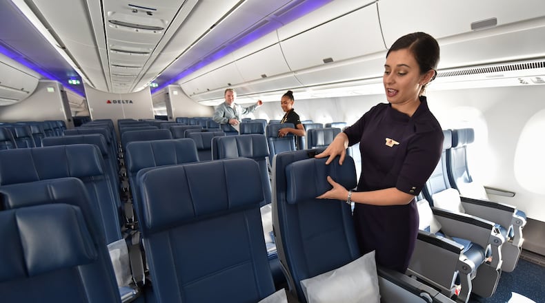 Kori Chapman, flight attendant, shows Airbus A350’s main cabin during a media event at Hartsfield-Jackson International Airport on Tuesday, October 17, 2017. HYOSUB SHIN / HSHIN@AJC.COM