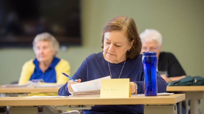 The Central DeKalb Senior Center offers a French culture and language course, where Kris Kane takes instruction from Elizabeth Wilson. (Jenni Girtman / Atlanta Event Photography)
