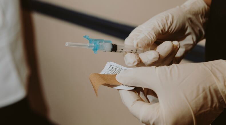 FILE - A health care worker prepares a COVID-19 vaccine in Jackson, Ala., Oct. 5, 2021. (Charity Rachelle/The New York Times)