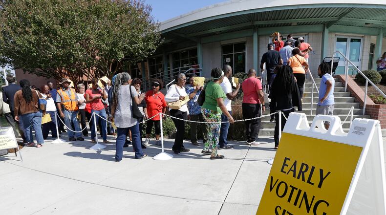 FILE - In this Oct. 20, 2016 file photo ,voters line up during early voting at Chavis Community Center in Raleigh, N.C. More than a dozen states have enacted tougher requirements for registering and voting since the U.S. Supreme Court overturned a key provision of the Voting Rights Act three years ago. That has led to confusion and claims that certain groups, mostly minorities who tend to vote with Democrats, are being disenfranchised. (AP Photo/Gerry Broome, File)