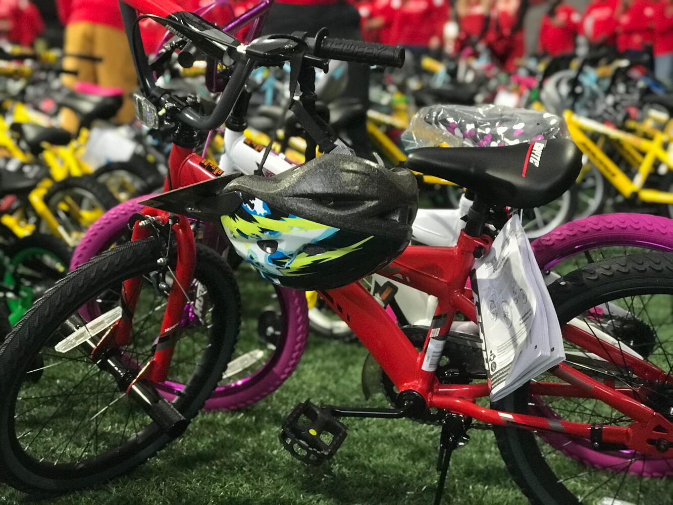 Delta volunteers assemble 100 bicycles to donate to kids