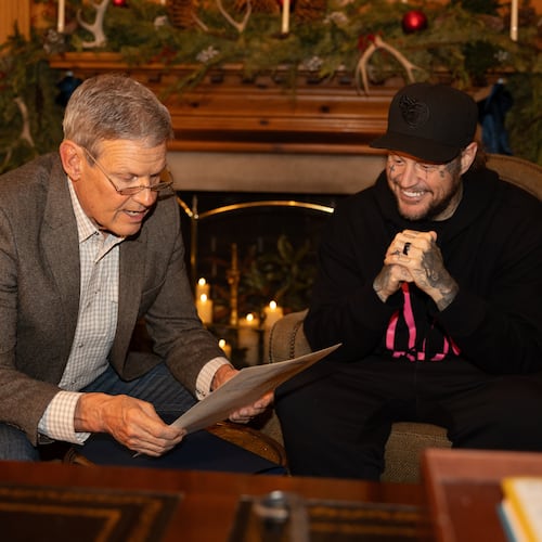 This photo provided by the office of Tennessee Gov. Bill Lee shows Gov. Bill Lee, left, giving country musician Jelly Roll news of his official pardon Thursday, Dec. 18, 2025, at the Tennessee Governor's Mansion in Oak Hill, Tenn. (Brandon Hull/Office of Gov. Bill Lee via AP)