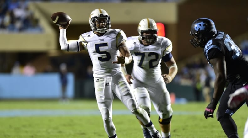 Oct 18, 2014; Chapel Hill, NC, USA; Georgia Tech Yellow Jackets quarterback Justin Thomas (5) throws a touchdown pass as North Carolina Tar Heels defensive tackle Justin Thomason (98) pressures in the second quarter at Kenan Memorial Stadium. Mandatory Credit: Bob Donnan-USA TODAY Sports Georgia Tech quarterback Justin Thomas' six touchdowns on third-and-long are the most of any quarterback in the ACC. (ASSOCIATED PRESS)