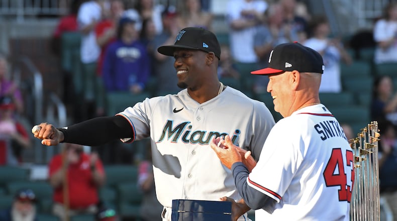April 23, 2022 Atlanta - Former Braves’ Jorge Soler (12) receives his World Series Championship ring from Atlanta Braves' manager Brian Snitker (43) before Atlanta Braves home game against Miami Marlins at Truist Park on Saturday, April 23, 2022. (Hyosub Shin / Hyosub.Shin@ajc.com)