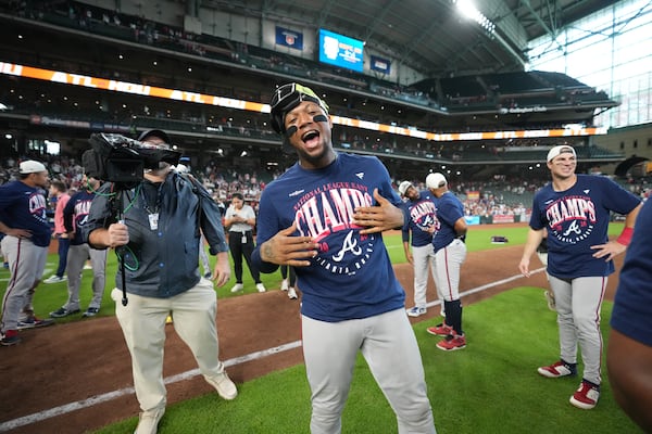 Ronald Acuna Jr. started the celebration early. (AP Photo/Karen Warren)