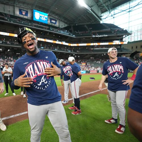 Atlanta Braves' Ronald Acuña Jr. (center) celebrates on the field after a game against the Houston Astros as the Braves clinches the NL East title, Sunday, Sept. 20, 2026, in Houston. (Karen Warren/AP)