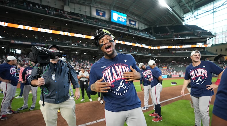 Atlanta Braves' Ronald Acuña Jr. (center) celebrates on the field after a game against the Houston Astros as the Braves clinches the NL East title, Sunday, Sept. 20, 2026, in Houston. (Karen Warren/AP)