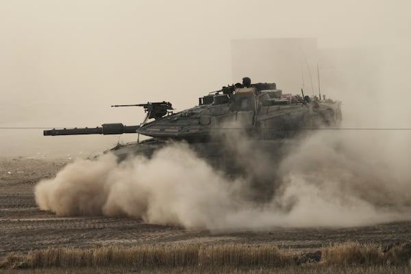 An Israeli tank moves in a staging area in southern Israel, near the border with Gaza, Friday, May 16, 2025. (AP Photo/Maya Alleruzzo)