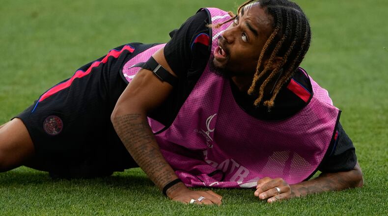 PSG's Bradley Barcola eyes the ball during a training session ahead of the UEFA Super Cup soccer match against Aston Villa in Salzburg, Austria, Tuesday, Aug. 11, 2026. (AP Photo/Darko Bandic)