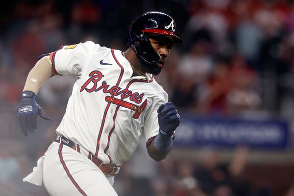 Atlanta Braves' Michael Harris II runs to first after hitting an RBI double to tie the game during the ninth inning of a baseball game against the Cincinnati Reds, Tuesday, May 6, 2025, in Atlanta. (AP Photo/Butch Dill)