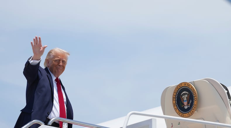 President Donald Trump waves as he boards Air Force One, Friday, June 5, 2026, at Joint Base Andrews, Md. (AP Photo/Mark Schiefelbein)