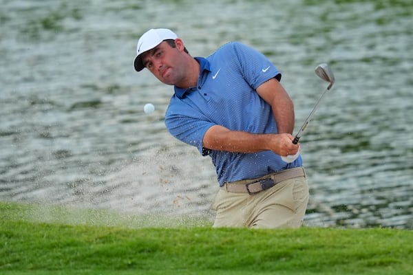 Scottie Scheffler hits out of a bunker on the 18th hole during the first round of the Charles Schwab Challenge golf tournament at Colonial Country Club in Fort Worth, Texas, Thursday, May 22, 2025. (AP Photo/LM Otero)