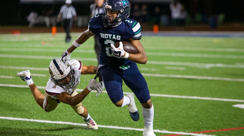Reggie Brigman, wide receiver for Harrison, dodges a tackle by Briyar Powers, wide receiver and defensive back for Pebblebrook, during the Harrison vs. Pebblebrook high school football game on Friday, September 23, 2022, at Harrison high school in Kennesaw, Georgia. Pebblebrook defeated Harrison 31-14. CHRISTINA MATACOTTA FOR THE ATLANTA JOURNAL-CONSTITUTION.