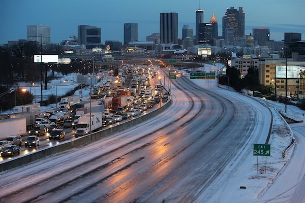 Snowstorms in 2014 forced state and local governments to hire contractors to treat roads and interstates. BEN GRAY / BGRAY@AJC.COM