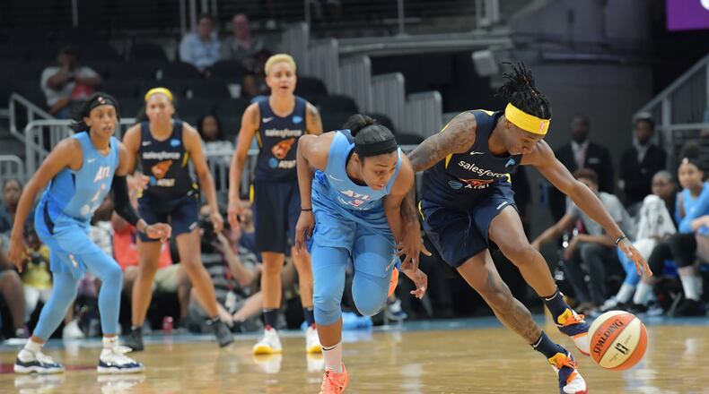 June 19, 2019 Atlanta - Atlanta Dream guard Renee Montgomery and Indiana Fever guard Erica Wheeler (right) fight for a loose ball during the second half of WNBA basketball game at State Farm Arena in Atlanta on Wednesday, June 19, 2019. Atlanta Dream won 88-78 over the Indiana Fever. HYOSUB SHIN / HSHIN@AJC.COM