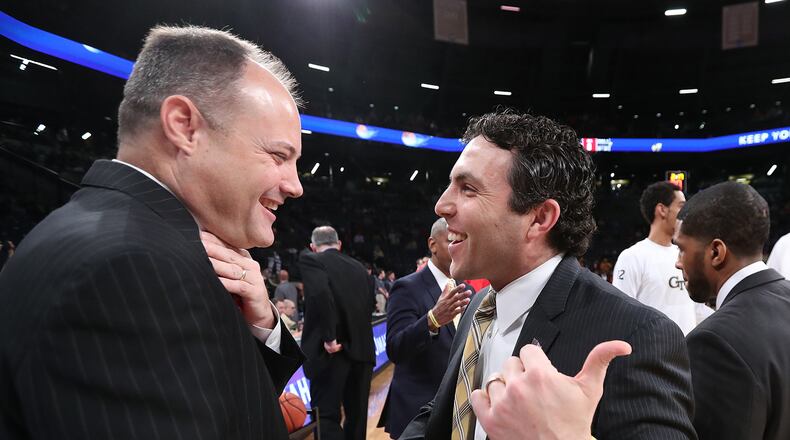 Georgia basketball coach Mark Fox (left) and Georgia Tech’s Josh Pastner were all smiles when they met for a game on Dec. 20. But only one is smiling now, late in the regular season. (Curtis Compton/ccompton@ajc.com)
