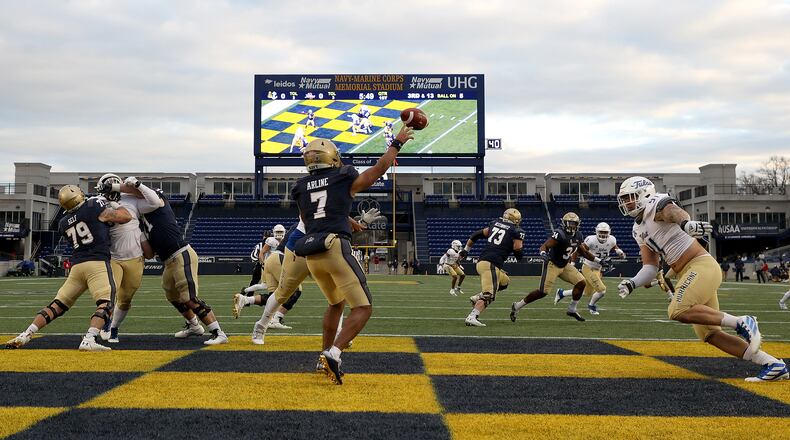 Navy quarterback Xavier Arline (7) gets off a pass against Tulsa on Saturday, Dec. 5, 2020, at Navy-Marine Corps Memorial Stadium in Annapolis, Maryland. (Rob Carr/Getty Images/TNS)