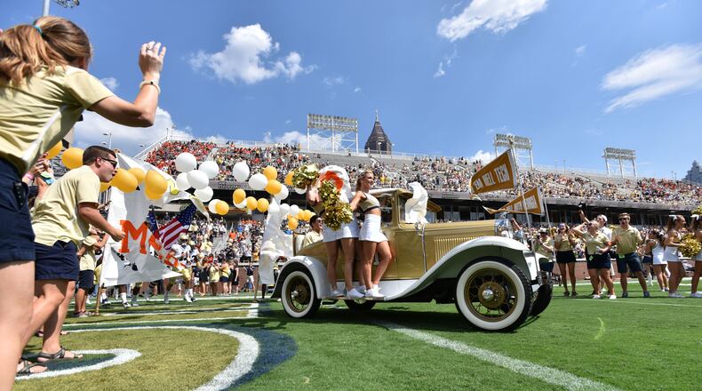 September 10, 2016 Atlanta - Georgia Tech's Ramblin' Wreck leads the band, cheerleaders, Buzz, players, and coaches before the start of the Georgia Tech home opener against against the Mercer on Saturday, September 10, 2016. HYOSUB SHIN / HSHIN@AJC.COM