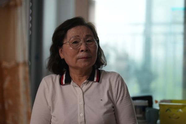 Son Myong Hwa, 63, the North Korea-born daughter of a South Korean POW held in the North, listens to a reporter's question during an interview in Gimpo, South Korea, on June 20, 2025. (AP Photo/Lee Jin-man)