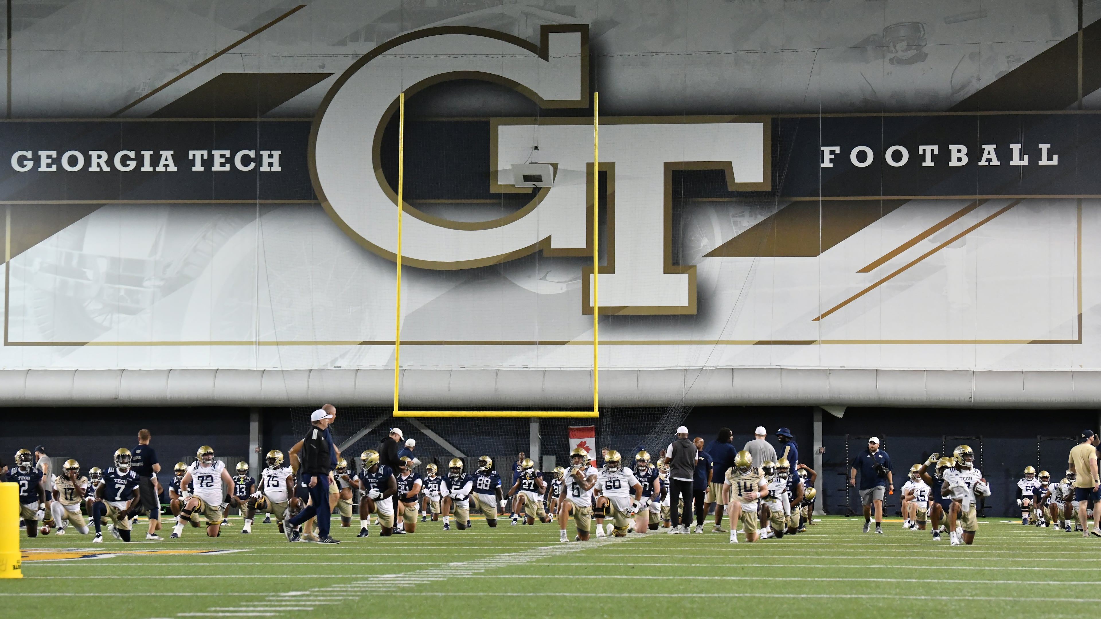 Georgia Tech players warm up during the first football practice of the season at Rose Bowl Field on the Georgia Tech Campus in Atlanta on Friday, August 5, 2022. (Hyosub Shin/AJC 2022)