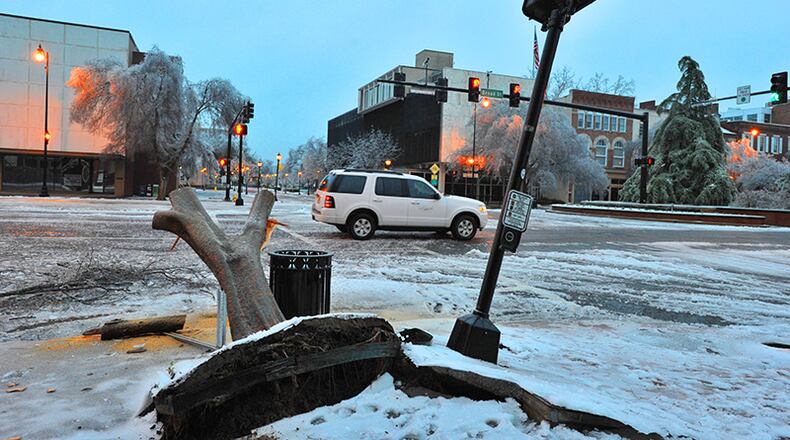 The ice storm caused many trees to break under heavy limbs on Broad Street in downtown August.