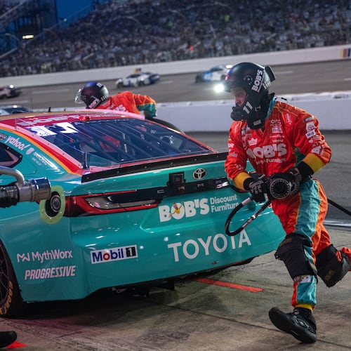 Joe Gibbs Racing driver Denny Hamlin (11) pit crew goes over the wall during Cook Out 400 at Richmond Raceway, Saturday, Aug. 15, 2026, in Richmond Va. (AP Photo/Robert Simmons)
