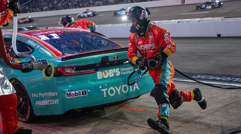 Joe Gibbs Racing driver Denny Hamlin (11) pit crew goes over the wall during Cook Out 400 at Richmond Raceway, Saturday, Aug. 15, 2026, in Richmond Va. (AP Photo/Robert Simmons)