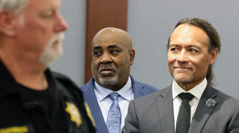 Duane Davis, center, stands with his attorney Michael Sanft, right, as prospective jurors enter the courtroom during the fourth day of jury selection for his murder trial in Clark County District Court at the Regional Justice Center on Thursday, Aug. 13, 2026, in Las Vegas. Davis was indicted on murder charges for his involvement in the killing of rapper Tupac Shakur in 1996. (Bizuayehu Tesfaye/Las Vegas Review-Journal via AP, Pool)