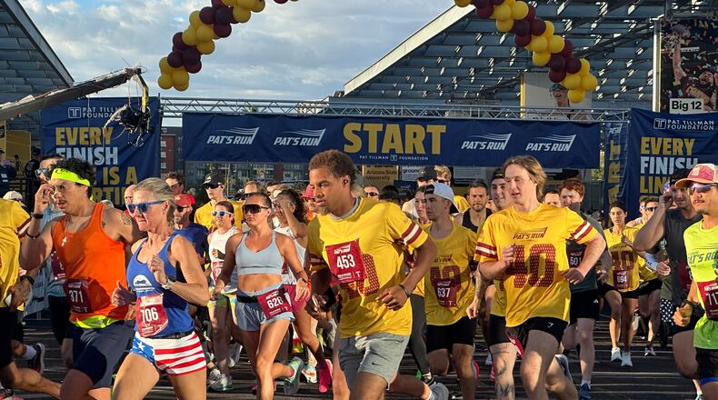 Runners take off at the start line of Pat's Run, a 4.2-mile race honoring former NFL player and Army Ranger Pat Tillman, in Tempe, Ariz., on Saturday, April 11, 2026. (AP Photo/John Marshall)