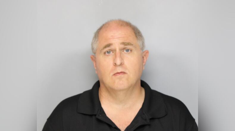 Gwinnett County police officer Michael James Brady, 49, has been charged with second-degree vehicular homicide and following too closely after he struck a moped driver while driving to work from Hall County on Friday, authorities said.