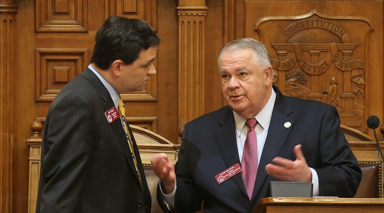 March 5, 2015 Atlanta: Rep. Sam Teasley (R-Marietta), left, talks with Speaker David Ralston (R-Blue Ridge) Thursday afternoon March 5, 2015. BEN GRAY / BGRAY@AJC.COM State Rep. Sam Teasley, left, and House Speaker David Ralston engage in an intense conversation during the debate over H.B. 170, the transportation funding bill. Ben Gray, bgray@ajc.com