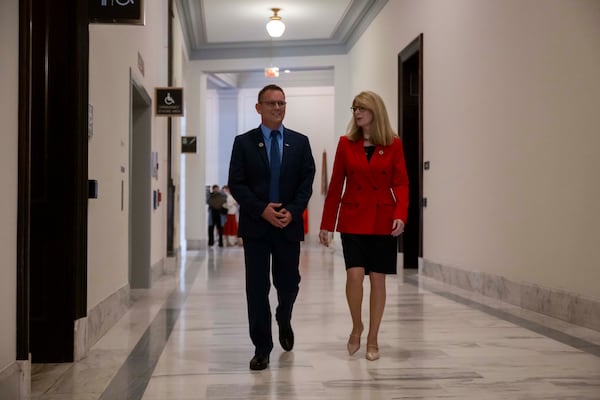 Tim and Sheri Lilley walk in the Russell Senate Office Building on Capitol Hill. While they had never lobbied in D.C. for anything before the crash, they scheduled their first lawmaker meetings less than a week after the accident. They've returned to D.C. nearly monthly ever since. (Craig Hudson for the AJC)