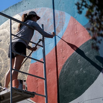 Local artists create murals live at the 11th annual Forward Warrior festival in the Cabbagetown neighborhood of Atlanta. (Olivia Bowdoin for the AJC/2025)