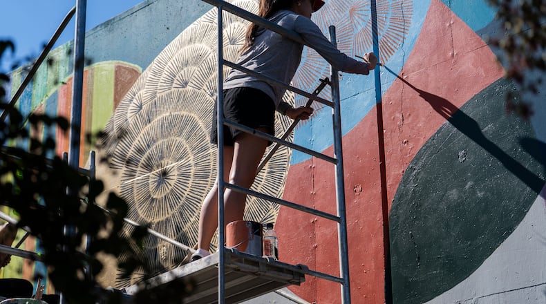Local artists create murals live at the 11th annual Forward Warrior festival in the Cabbagetown neighborhood of Atlanta. (Olivia Bowdoin for the AJC/2025)