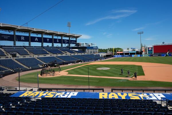 Tampa Bay Rays grounds crew members prepare the field for a practice at George M. Steinbrenner Field during a stadium tour Wednesday, March 26, 2025, in Tampa, Fla. (AP Photo/Chris O'Meara)