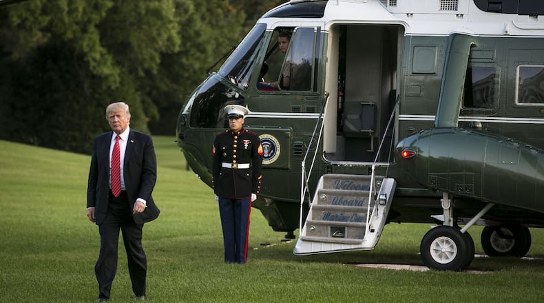 President Donald Trump arrives at the White House on Wednesday after a trip to Reno, Nev., one of many he’s made as president. Calculating the costs to taxpayers of Trump’s travels and protection for his many residences is not simple. (Al Drago/The New York Times)