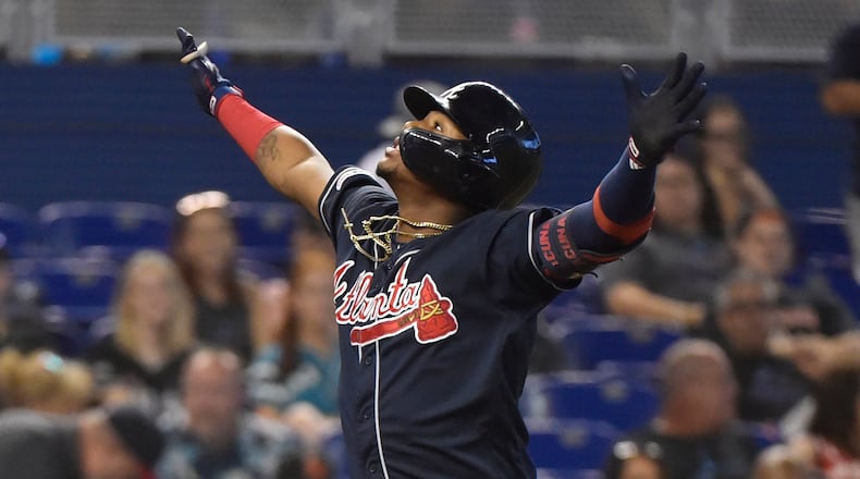 Braves outfielder Ronald Acuna celebrates before crossing home plate after hitting his 33rd home run of the season in the fifth inning against the Miami Marlins Sunday, Aug. 11, 2019, at Marlins Park in Miami.