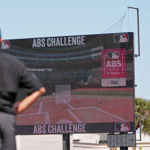 Umpire Ryan Additon watches as a call is challenged using MLB's ABS challenge system during the third inning of a spring training baseball game between the Miami Marlins and the Houston Astros Wednesday, Feb. 25, 2026, in Jupiter, Fla. (AP Photo/Jeff Roberson)