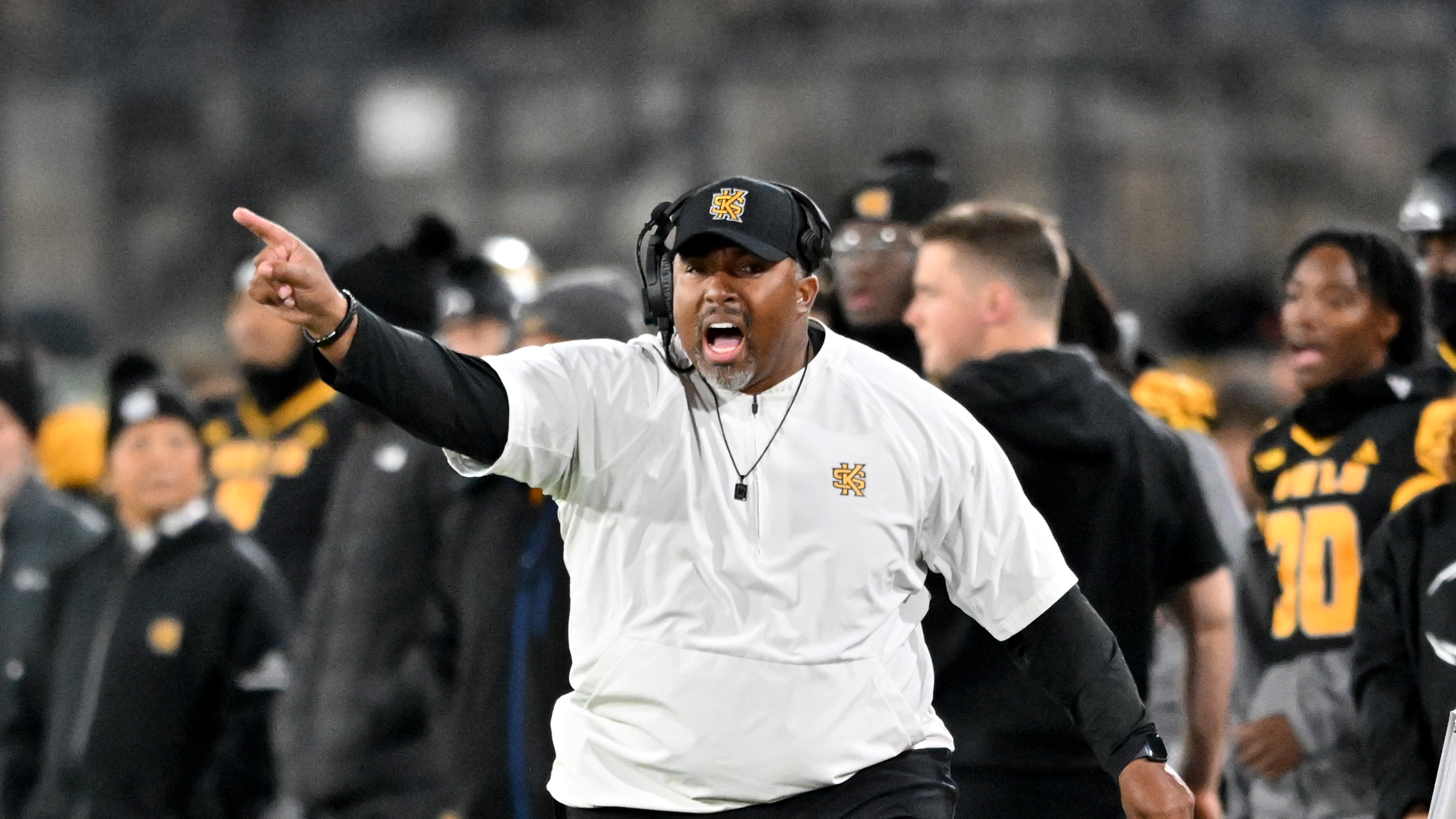 Kennesaw State head coach Jerry Mack shouts instructions during the first half in an NCAA college football game at Fifth Third Stadium, Tuesday, October 28, 2025, in Kennesaw. (Hyosub Shin/AJC)