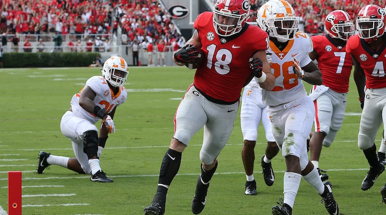 Georgia's Isaac Nauta turns potential disaster into a touchdown, recovering a Jake Fromm fumble and running it in for a touchdown. (Curtis Compton/Atlanta Journal-Constitution/TNS)