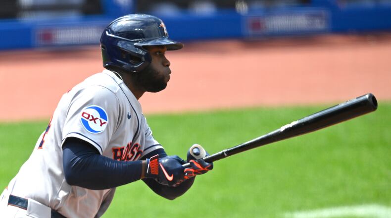 Houston Astros' Yordan Alvarez singles in the sixth inning of a baseball game against the Cleveland Guardians in Cleveland, Wednesday, April 22, 2026. (AP Photo/David Richard)